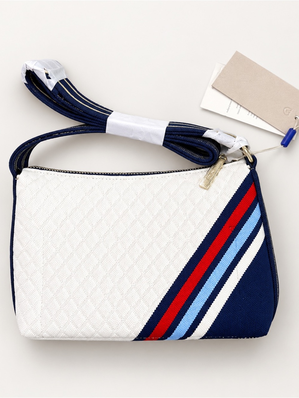 Rothy’s White and Navy Crossbody Bag with Red & Light Blue Stripes